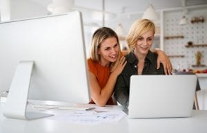 Startup business partners women working together in office
